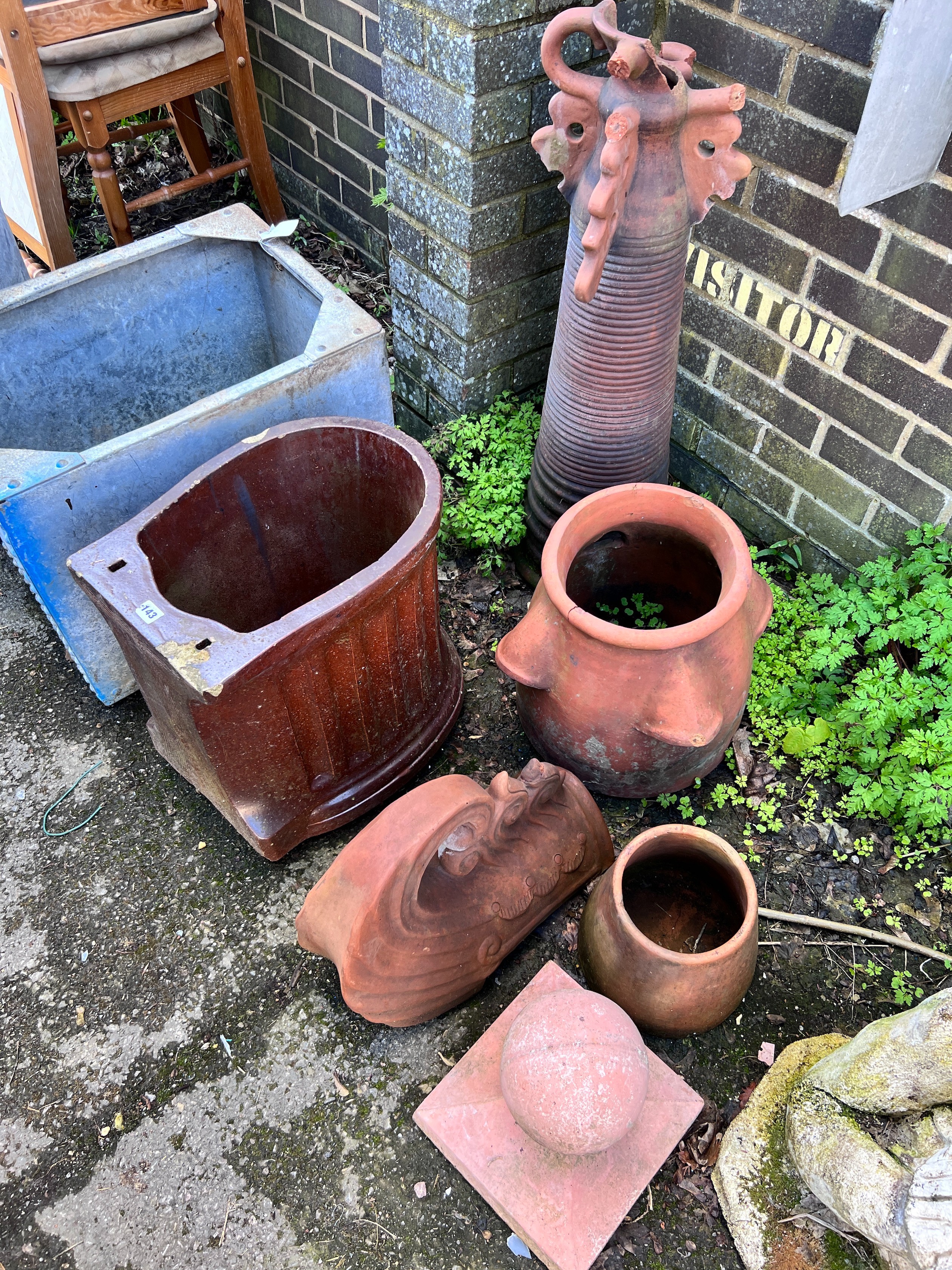 Six assorted terracotta and earthenware planters and ornaments *Please note the sale commences at 9am.